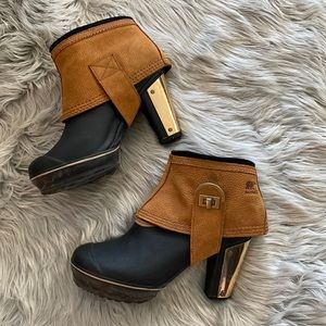 Very unique rubber Sorel heels with leather and gold accents. Size 8.5.